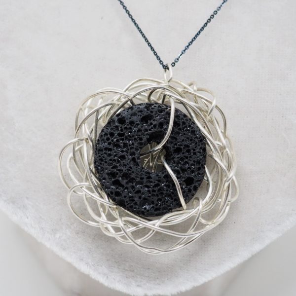black basalt stone, wrapped in a silver nest
