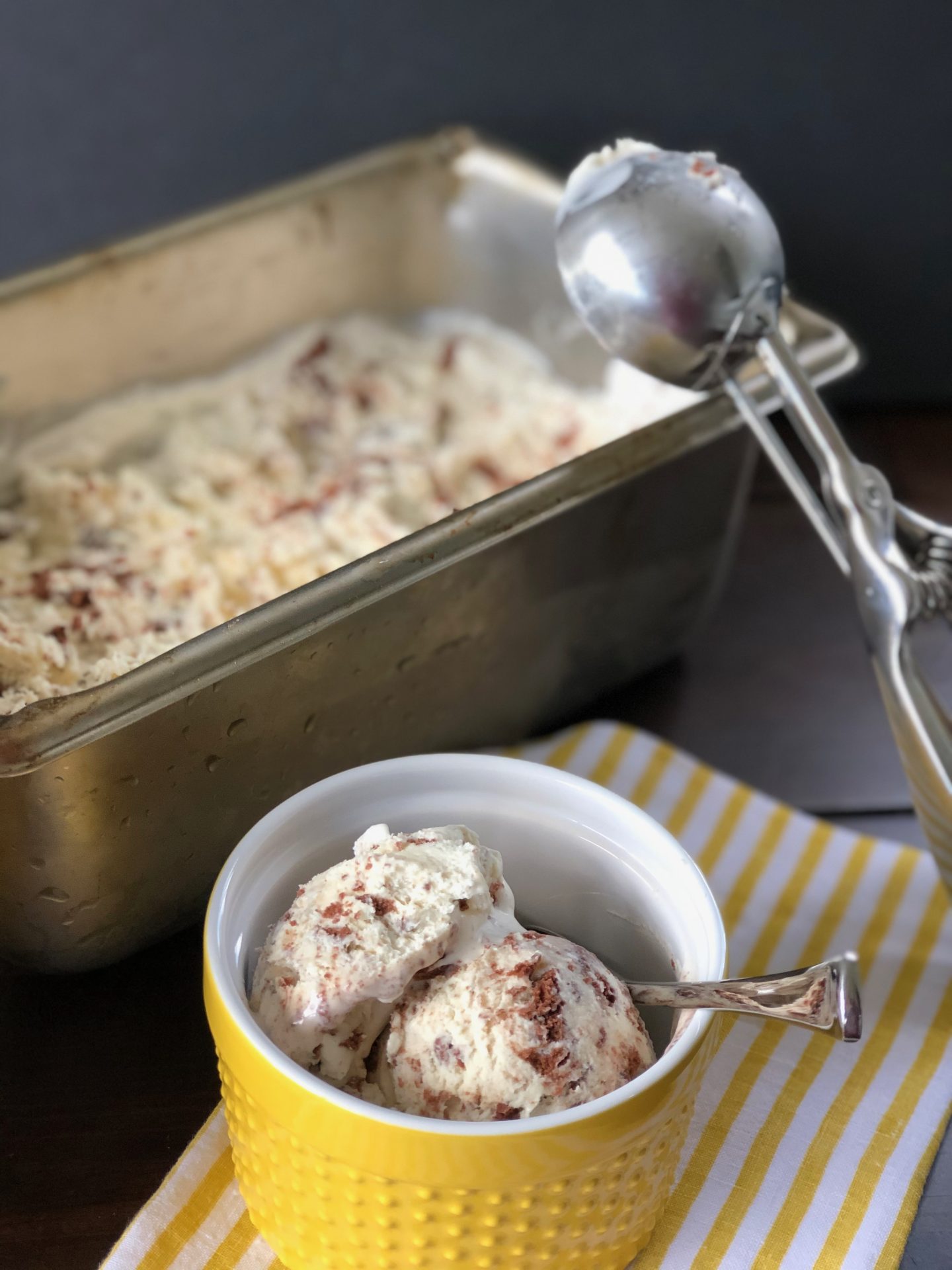 Quente e Frio no-churn ice cream sliced and drizzled with chocolate sauce